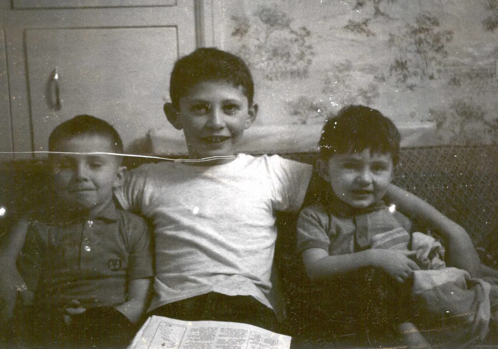 Vintage family portrait with deep scratches before RestorePhotosApp AI restoration