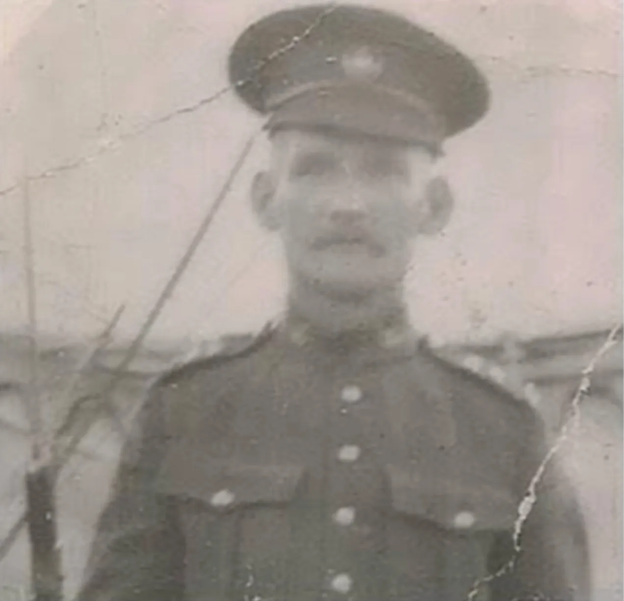 Faded old military service photo before AI restoration
