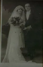 Faded old wedding photo before AI restoration